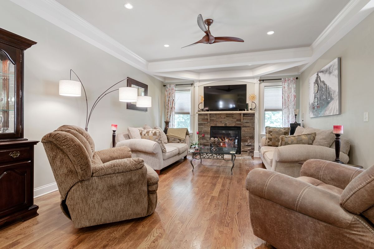 Living room with a smooth, freshly painted ceiling and crown molding — the updated look buyers compare listings against