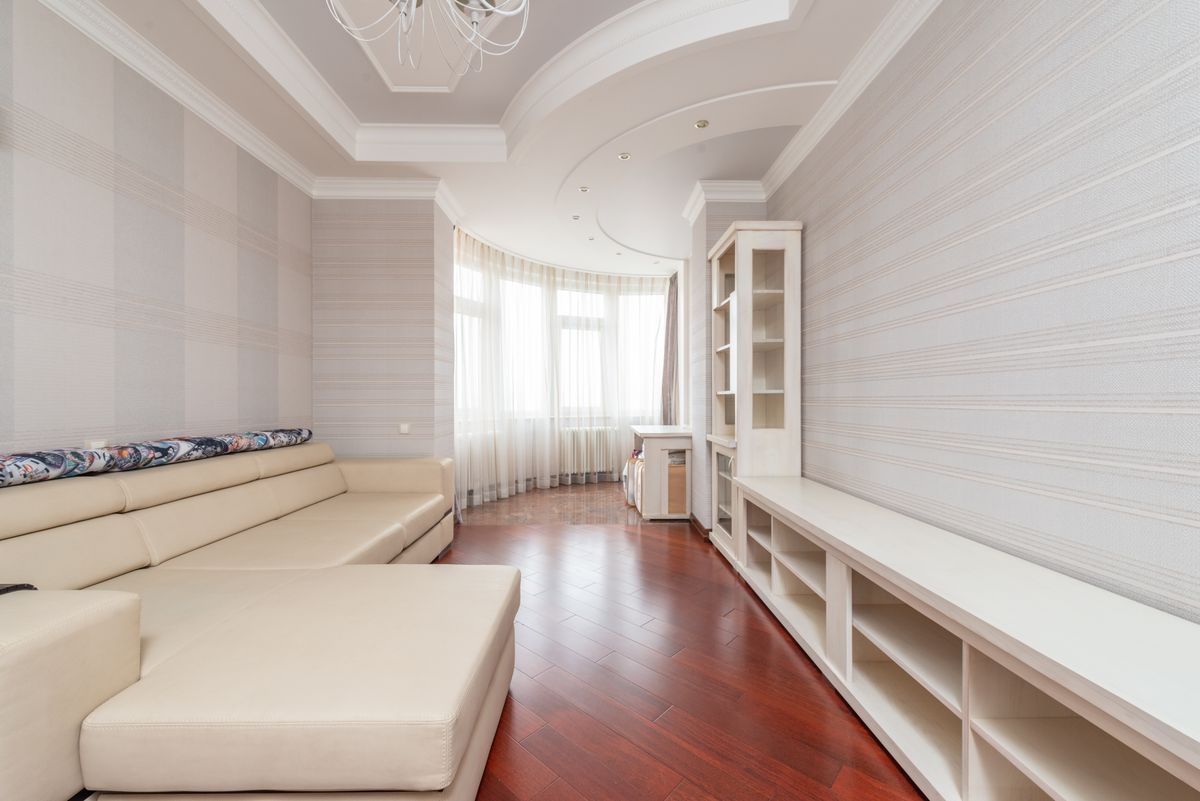 Smooth, retextured multi-level ceiling in a bright, elegant living room